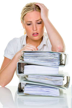 young woman in office is overwhelmed with work  burnout in work or study の写真素材
