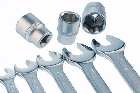 different tools of a craftsman lie side by side on white background