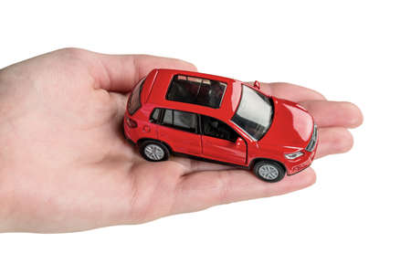 hand keeps model of a carの写真素材