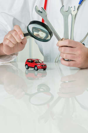 car is checked by a doctor  costs for maintenance and repairの写真素材