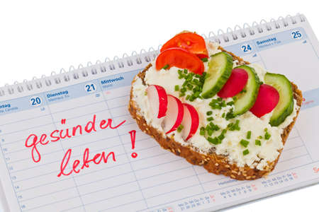 bread with vegetables and a calendarの写真素材