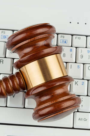 gavel on computer keyboard, symbolic photo for e-commerce and consumer protection