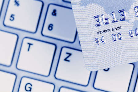 close-up a credit card for cashless payment and keyboard. photo icon for shopping on the internet.の写真素材