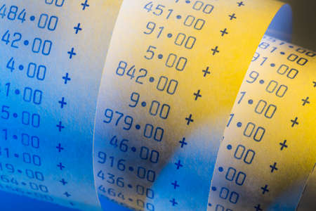 the computational stripes of a calculator on a white background. symbolic photo for controlling, accounting, taxation and financeの写真素材