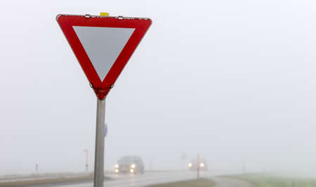 car driving in the fog. poor visibility for drivers in foggy weather.の写真素材