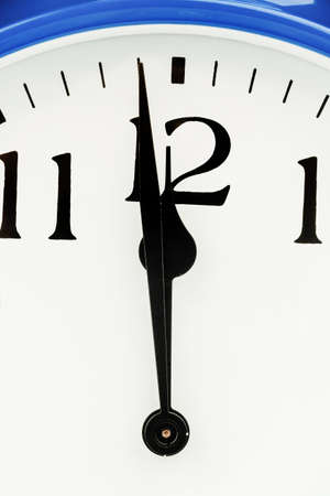 a blue alarm clock on whiteの写真素材