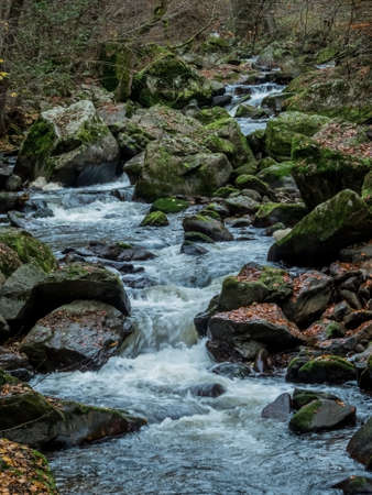 a creek with rocks and running water. landscape experience in nature.の写真素材