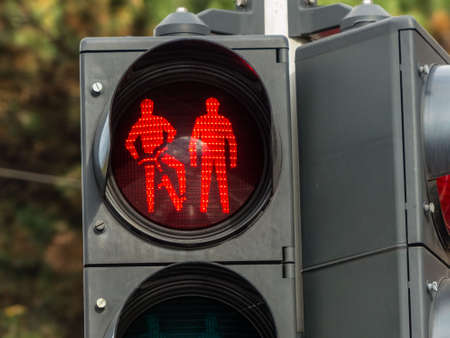 end of red light for bike lane and sidewalk. impact on road trafficの写真素材