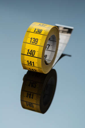 yellow tape measure, symbolic photo for diet control and precisionの写真素材