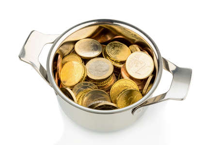 a cooking pot, half filled with euro coins, symbolic photo for sovereign debt and financial needs