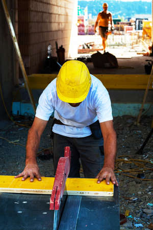 construction workers on the construction site of a new company and industrial buildingの写真素材