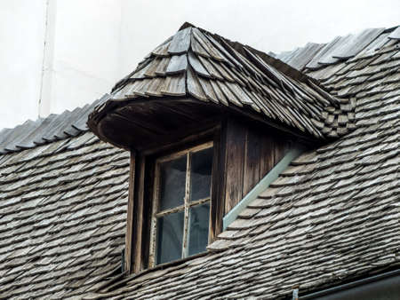 old house with dormer and shingles. old architecture revived.の写真素材