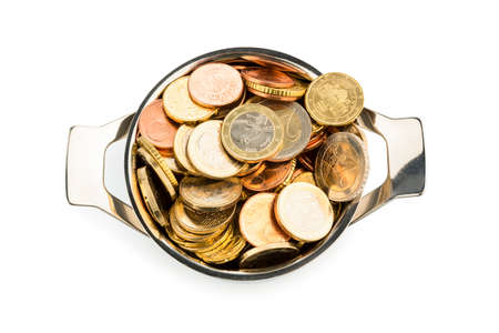 a pressure cooker is filled with euro coins, symbolic photo for grants and subsidiesの写真素材