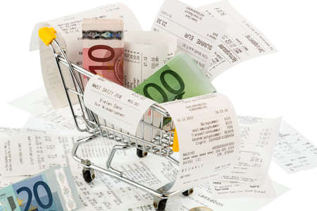 shopping cart, bills and receipts, symbol photo for purchasing power, consumption and inflationの写真素材