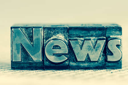 the word news written with lead letters. symbolic photo for newsletters, newspapers and informationの写真素材