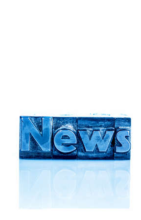 the word news written with lead letters. symbolic photo for newsletters, newspapers and informationの写真素材