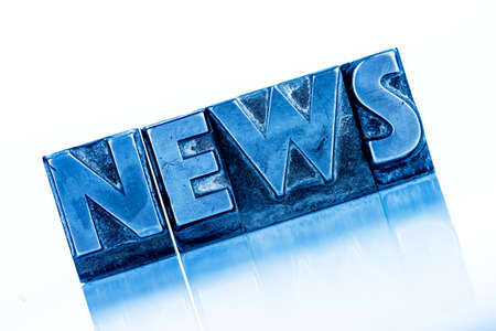 the word news written with lead letters. symbolic photo for newsletters, newspapers and informationの写真素材