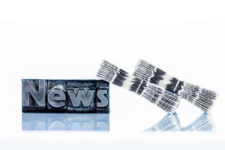 the word news written with lead letters. symbolic photo for newsletters, newspapers and informationの写真素材
