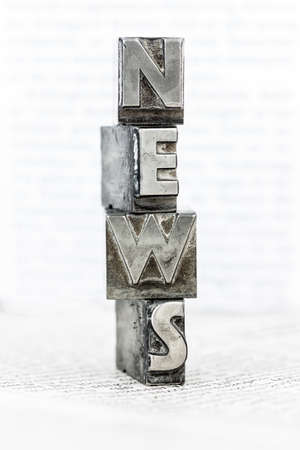 the word "news" written with lead letters an old printing pressの写真素材