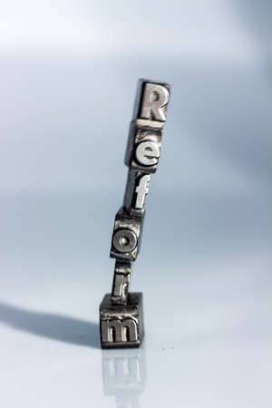 the word "reform" in lead letters written. symbolic photo for quick correspondenceの写真素材