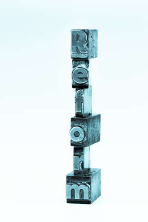 the word "reform" in lead letters written. symbolic photo for quick correspondenceの写真素材