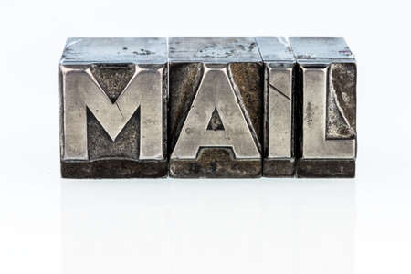 the word "e-mail" in lead letters written. symbolic photo for quick correspondenceの写真素材