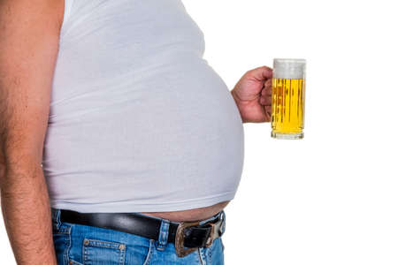 man with overweight. symbolic photo for beer belly, unsuccessful diets and poor diet.の写真素材