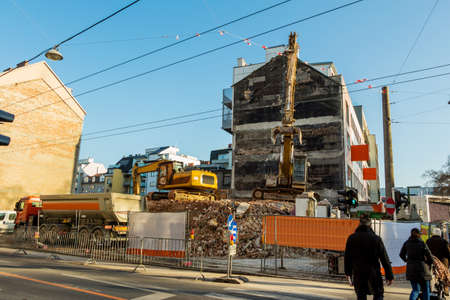 excavator on a construction site during the demolition of a hauses.platz for new housing and living...