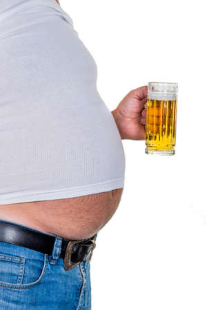 man with overweight. symbolic photo for beer belly, unsuccessful diets and poor diet.の写真素材
