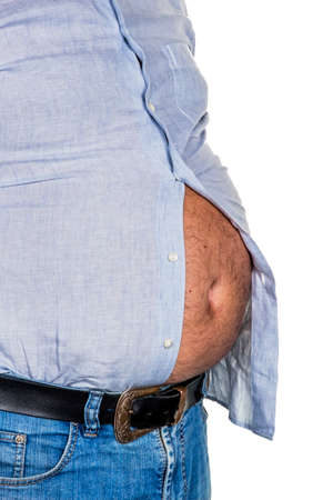 man with overweight. symbolic photo for beer belly, unsuccessful diets and poor diet.の写真素材