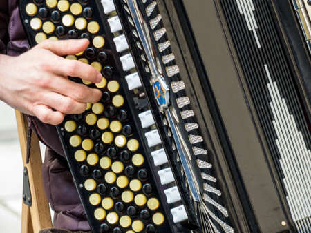 musician playing on accordion. street music is popularの写真素材
