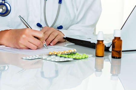 a young doctor prescribes medication. prescription pills are prescribed by the doctor.の写真素材