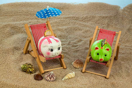 beach chair with euro currency on the sandy beach. の写真素材