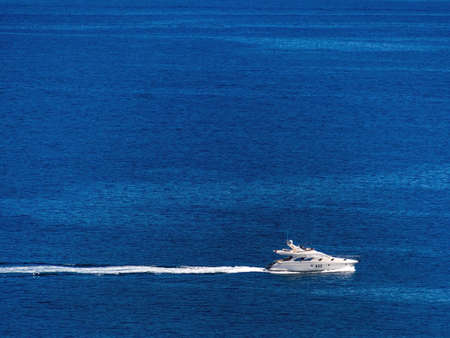 motor yacht at sea, symbolic photo for luxury, leisure, vacationの写真素材