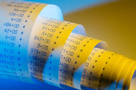 the computational stripes of a calculator on a white background. photo icon for controlling, accounting, taxation and financeの写真素材