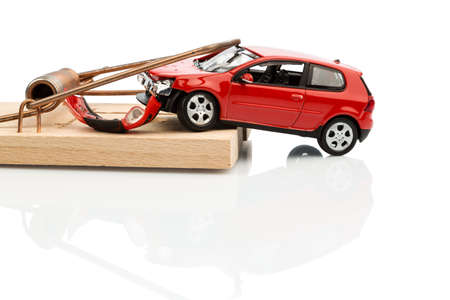 a model car in a mousetrap, symbolic photo for car expenses and liabilitiesの写真素材