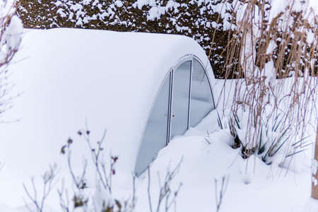 greenhouse in the snow, photo icon for the winter, frost protection and dormantの写真素材