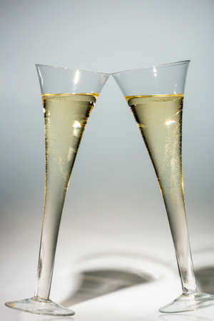 champagne or sparkling wine in a champagne glass. photo icon for celebrations, new year and good humorの写真素材