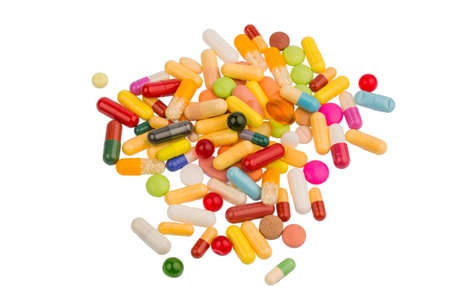 many colorful pills on a white background. symbolic photo for medicine and drugs