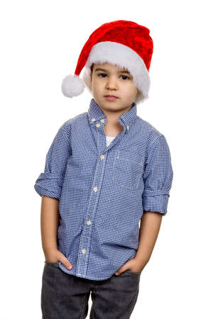 little boy with santa hat, symbol of christmas, self-confidence, transparencyの写真素材