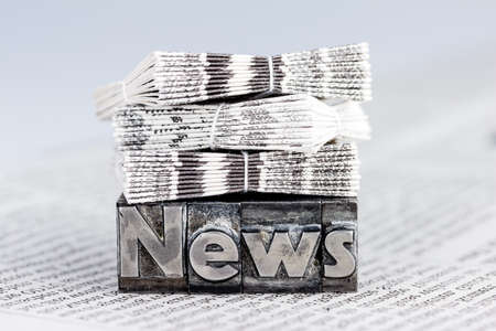 the word news written with lead letters. photo icon for newsletters, newspapers and informationの写真素材