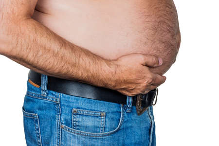 man with overweight. symbolic photo for beer belly, unsuccessful diets and poor dietの写真素材