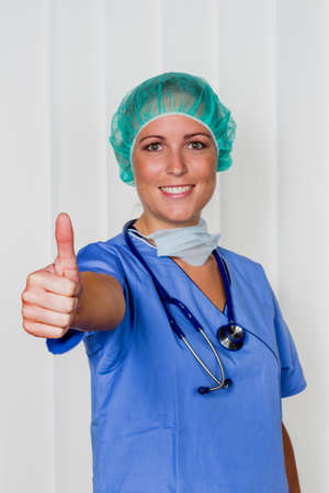 a friendly surgical doctor in hospital after successful surgeryの写真素材