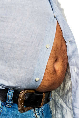 man with overweight. symbolic photo for beer belly, unsuccessful diets and poor diet.の写真素材