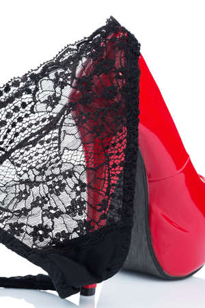 red high heels and a black panties, symbolic photo for erotic and fetishの写真素材