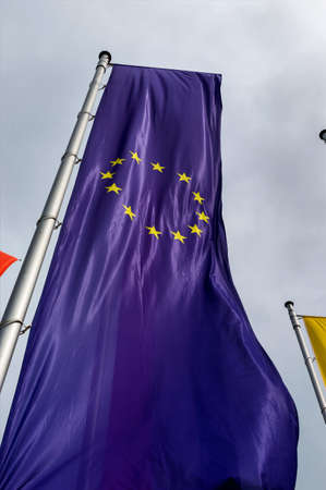 european flag and other flags, symbols for diplomacy and international cooperation