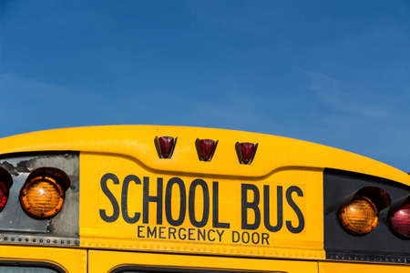 a typical american school bus in yellow colorの写真素材