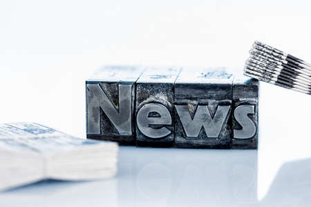 the word news written with lead letters. photo icon for newsletters, newspapers and information