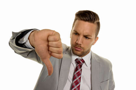 a young entrepreneur turns his thumbs down