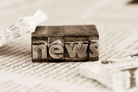 the word news written with lead letters. photo icon for newsletters, newspapers and informationの写真素材